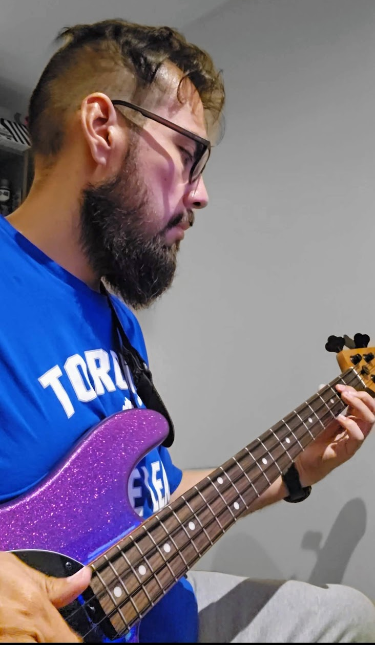 Diego Del Aguila playing bass guitar